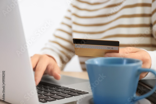 Woman with credit card and ...