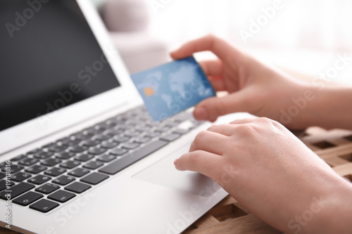 Woman holding credit card w...