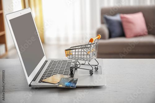 Laptop, small shopping trol...