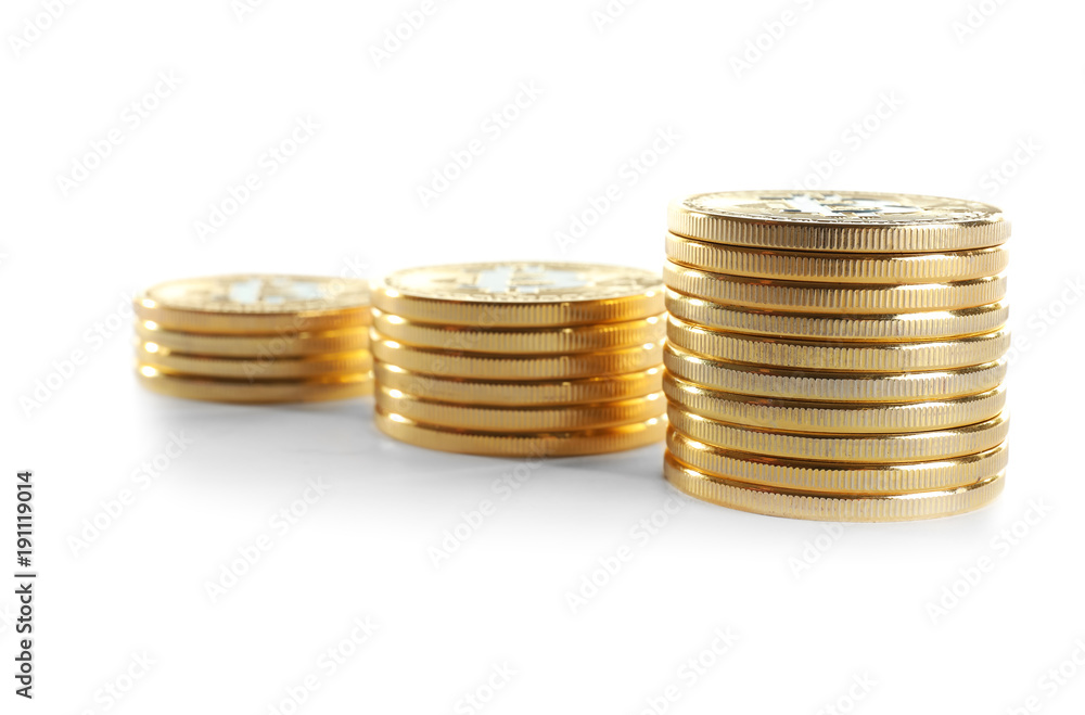 Stacks of golden bitcoins on white background Stacks of golden bitcoins on white background