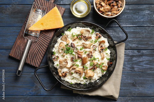 Canvas Print Dish with risotto and mushrooms on table