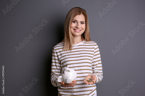 Young woman with broken pig...