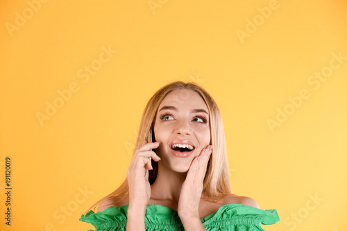 Young woman talking on cell...