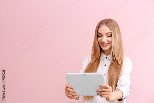Young woman with tablet com...