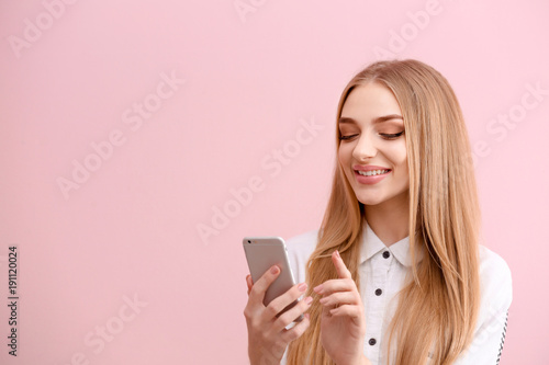 Young woman with cell phone...