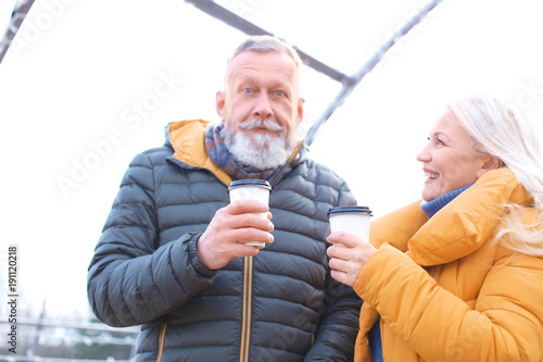 Happy mature couple with co...