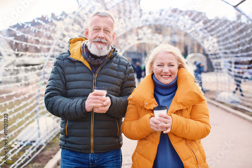 Happy mature couple with co...