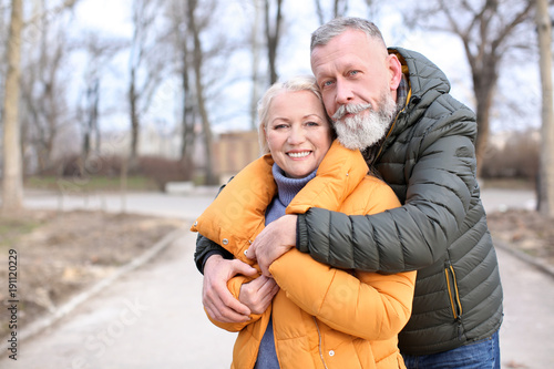 Happy mature couple hugging...