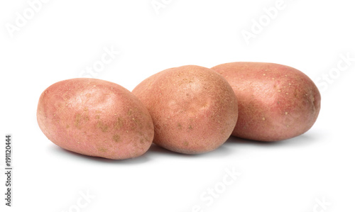 Fresh raw potatoes on white background