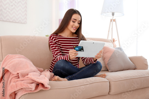 Young woman shopping online...