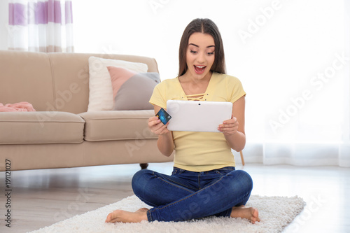 Young woman shopping online...