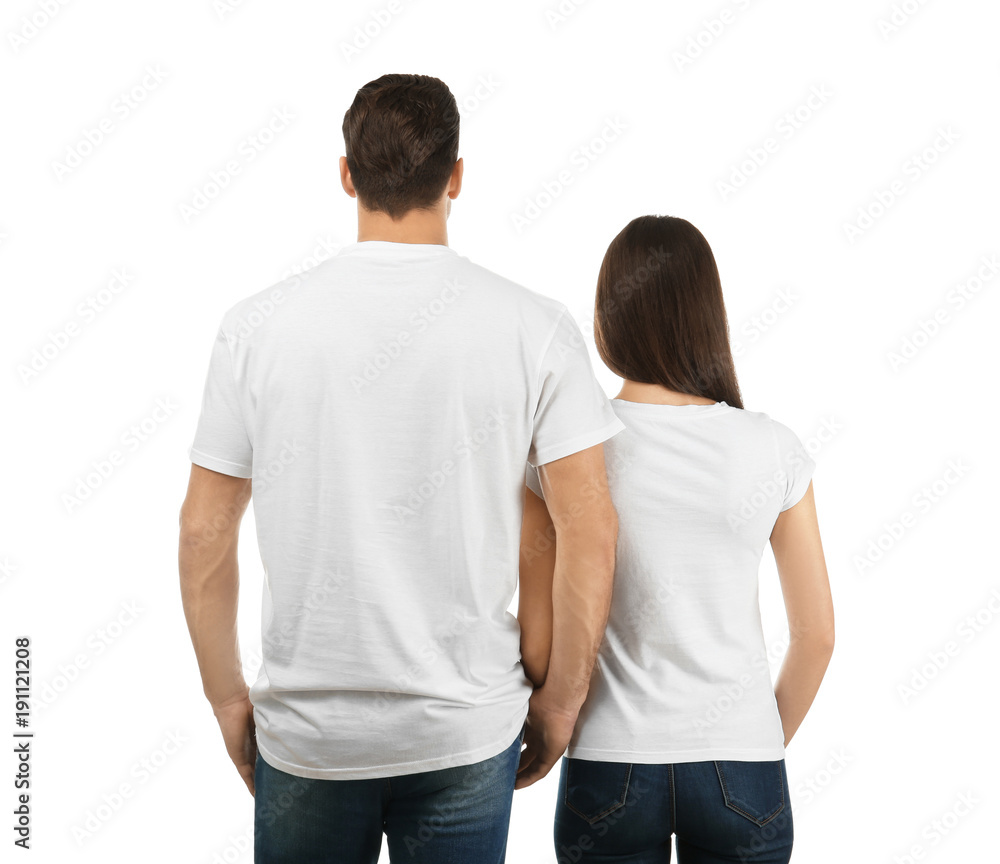 Young man and woman in stylish t-shirts on white background. Mockup for design Young man and woman in stylish t-shirts on white background. Mockup for design