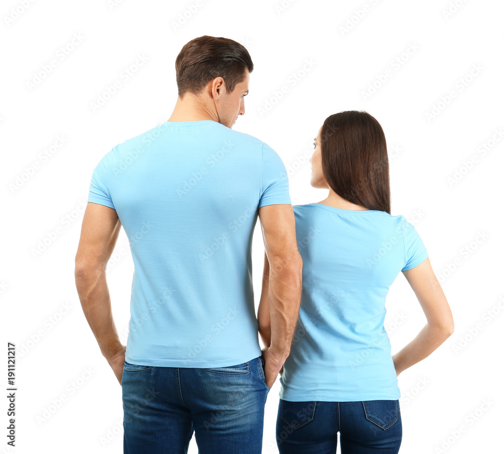 Young man and woman in stylish t-shirts on white background. Mockup for design Young man and woman in stylish t-shirts on white background. Mockup for design