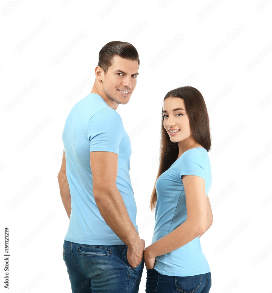 Young man and woman in stylish t-shirts on white background. Mockup for design Young man and woman in stylish t-shirts on white background. Mockup for design