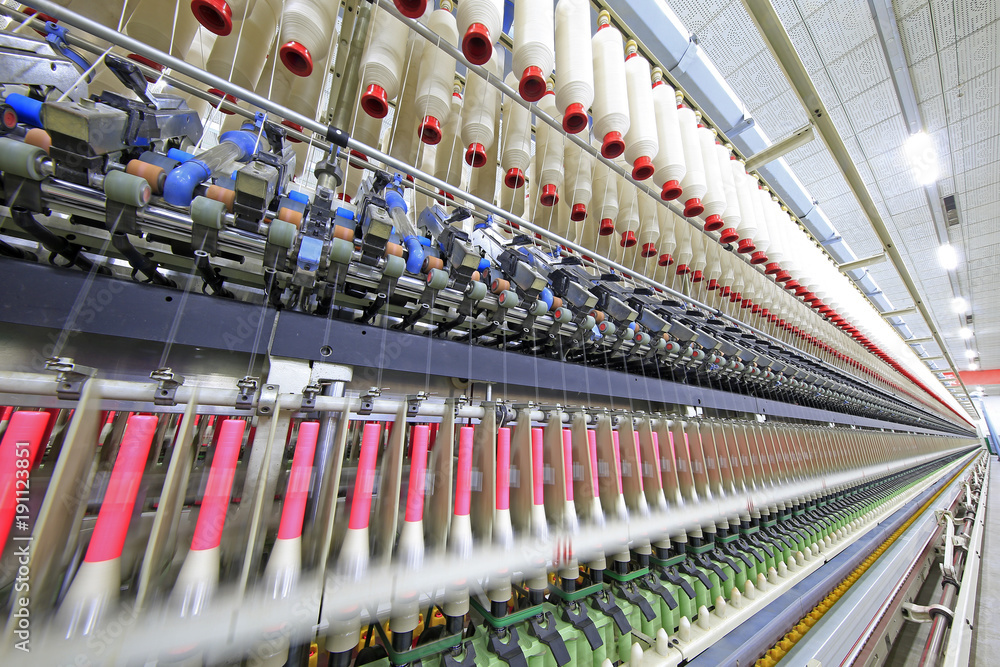 The modern spinning machine works in the workshop The modern spinning machine works in the workshop
