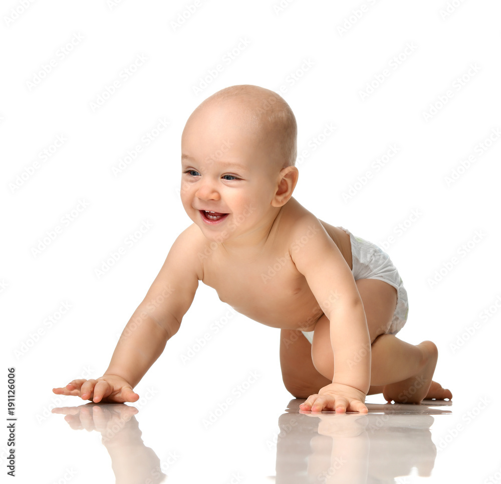Infant child boy toddler sitting naked in diaper crawl happy smiling isolated Infant child boy toddler sitting naked in diaper crawl happy smiling isolated
