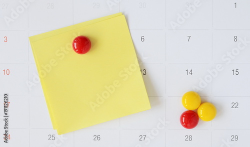Paper notes and magnetic clips on calendar with copy space for writing your work or new idea,office supplies.