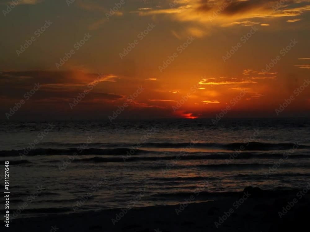 Sunset on the Gulf of Mexico at St. Pete Beach, Florida with boats and birds going through the frame. Sunset on the Gulf of Mexico at St. Pete Beach, Florida with boats and birds going through the frame.