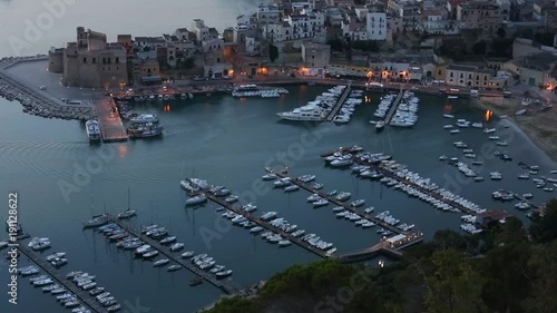 Early morning preceding dawn Tyrrenian sea bay near Castellammare del Golfo town, firtress and pier from resting place Localita Belvedere Castellammare del Golfo (Trapani region, Sicily, Italy).