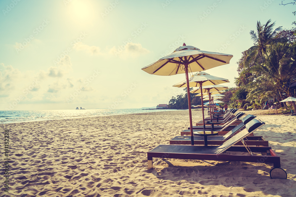 Fototapeta premium Umbrella and chair on the beach and sea