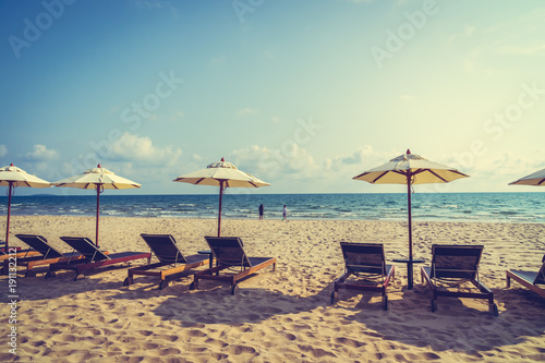 Umbrella and chair on the beach and sea