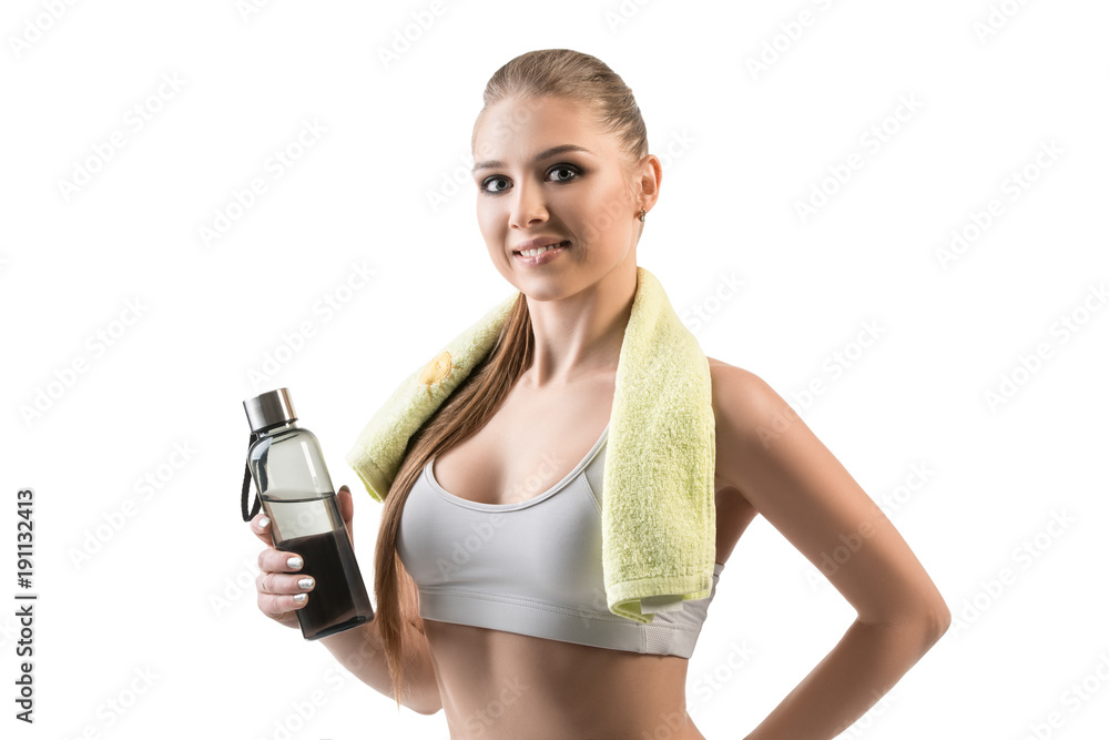Beautiful girl in top with towel and bottle shot Beautiful girl in top with towel and bottle shot