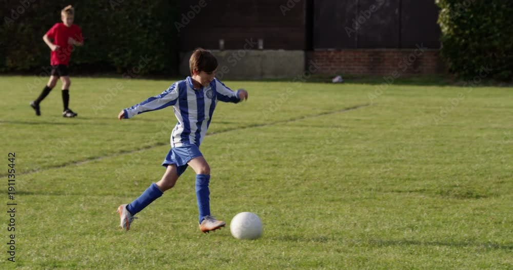 Children's soccer team on the field. Shot in slow motion on RED Epic. Children's soccer team on the field. Shot in slow motion on RED Epic.