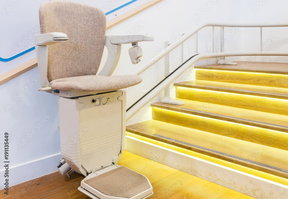 Automatic stair lift on staircase for elderly people and disabled persons  Photos | Adobe Stock
