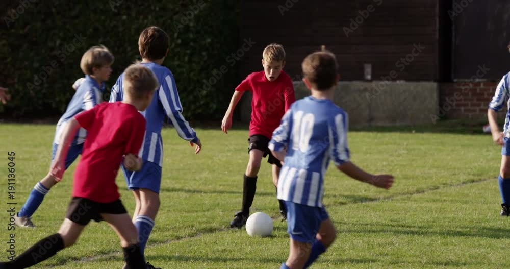 Children's soccer team on the field. Shot in slow motion on RED Epic. Children's soccer team on the field. Shot in slow motion on RED Epic.