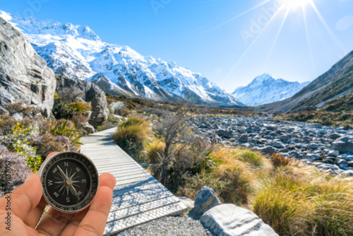 Compass with natural blur background. Travel concept.