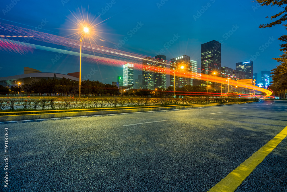 Fototapeta premium the light trails on the modern building background.
