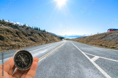 Compass with natural blur background. Travel concept. photo