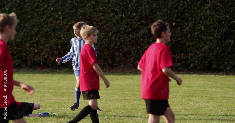 Children's soccer team on the field. Shot in slow motion on RED Epic. Children's soccer team on the field. Shot in slow motion on RED Epic.