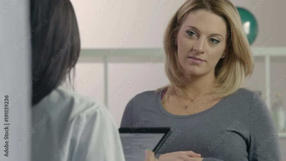 Female patient receiving advice from female health professional Female patient receiving advice from female health professional