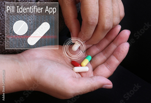Wall Mural Pill Identification Tool. Girl holding in hand pill.