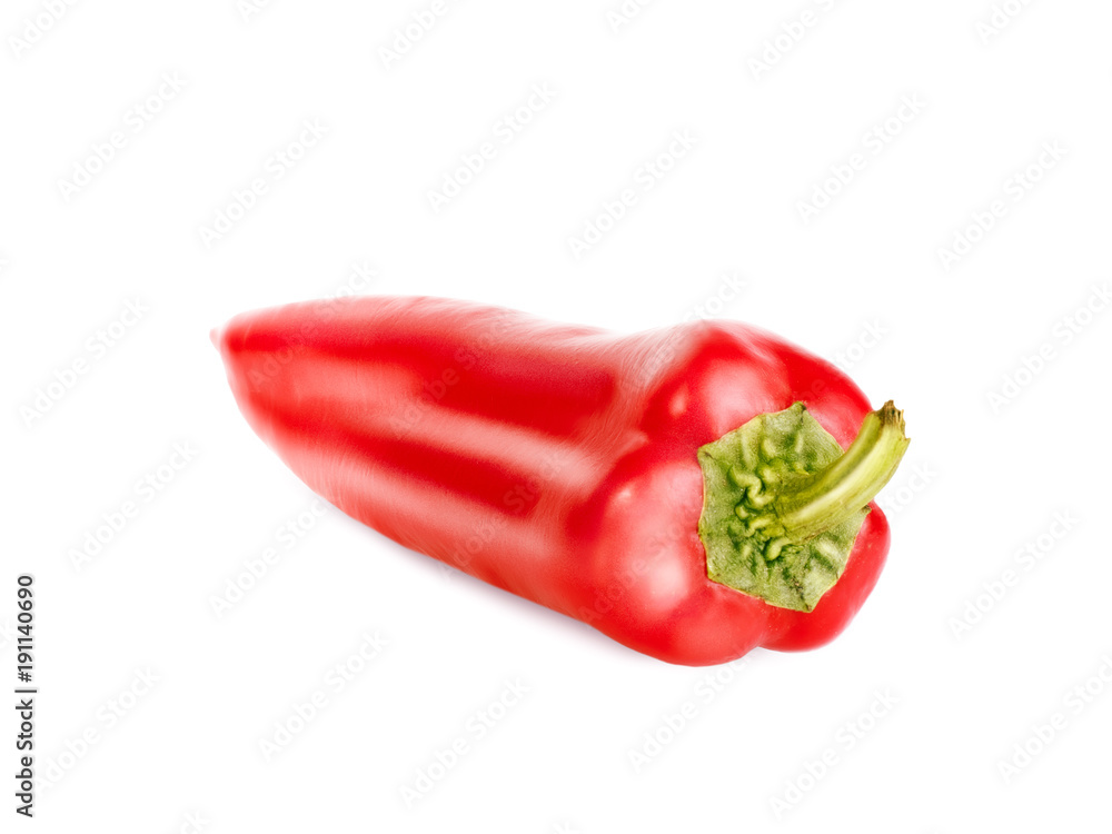Red juicy pepper with green tail isolated on white background. Retouched pepper with texture, glare and shadow pepper lies on a white. Close-up view.