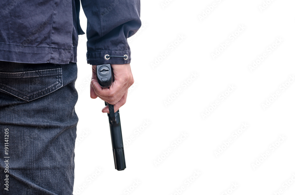 Man in a jeans holding a gun isolated on white. cropped shot of man holding gun in hand. Man in a jeans holding a gun isolated on white. cropped shot of man holding gun in hand.