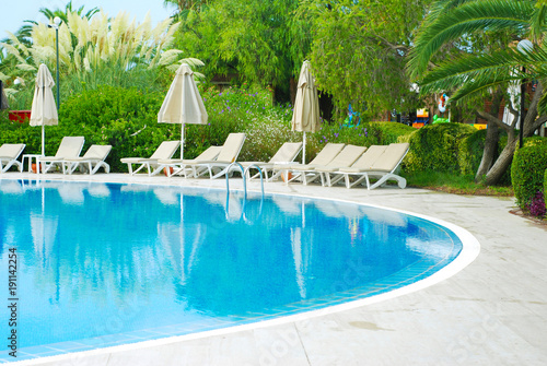 Beautiful Luxury Hotel Swimming Pool Resort with Umbrella and Chairs. Turkey, Side. Summer Vacation.