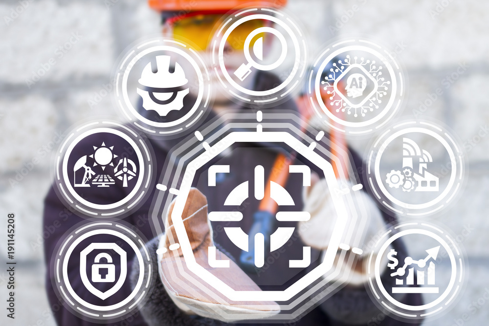 Industrial worker offers focus (purpose) icon on a virtual interface. Focus Development Industry 4.0. Target Modern Manufacture AI Information Technology Integrate concept. Industrial worker offers focus (purpose) icon on a virtual interface. Focus Development Industry 4.0. Target Modern Manufacture AI Information Technology Integrate concept.
