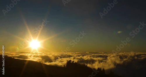 timelapse of sunset above the clouds on the slopes of haleakala in muai hawaii