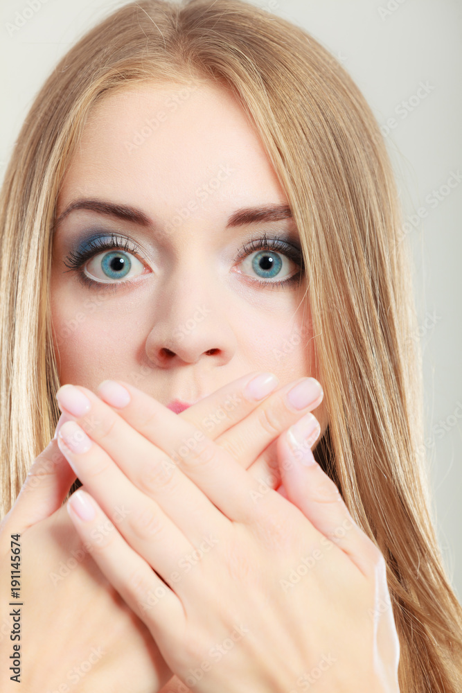 Amazed woman covering her mouth with hands Amazed woman covering her mouth with hands