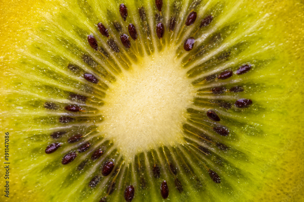 Heart of kiwi fruit with seeds close-up in a cut. Heart of kiwi fruit with seeds close-up in a cut.