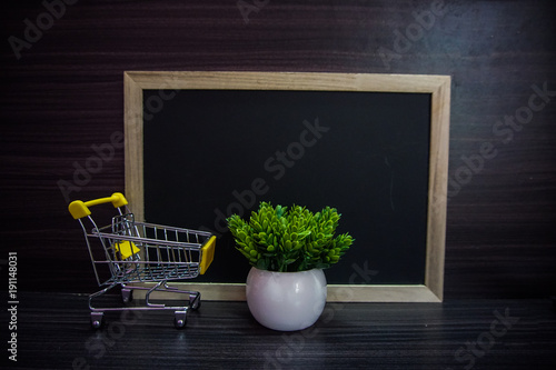 Red clock ,cute toy and Empty blackboard for copy space area