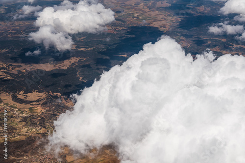 Foto White Cumulus Clouds seen from Window of Airplane