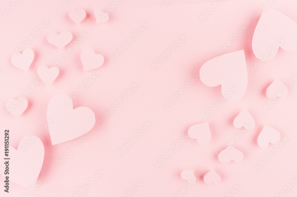 Soft pink paper hearts on light background, copy space. Concept design for Valentines day.