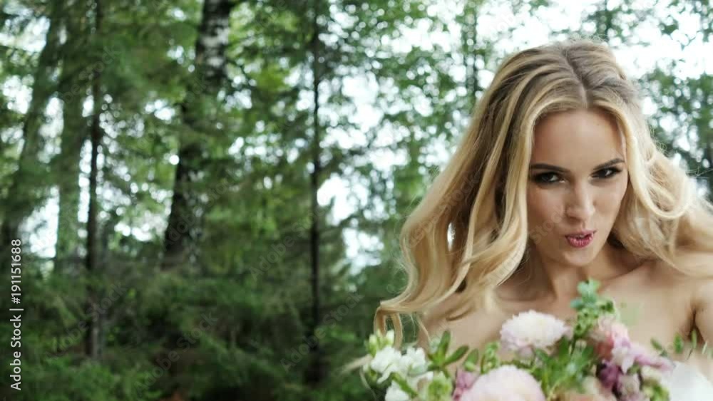 Beautiful bride at the wedding day. Pretty blonde woman in white dress having fun Beautiful bride at the wedding day. Pretty blonde woman in white dress having fun
