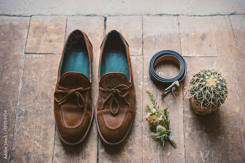 Mens shoes with wedding accessories and cactus