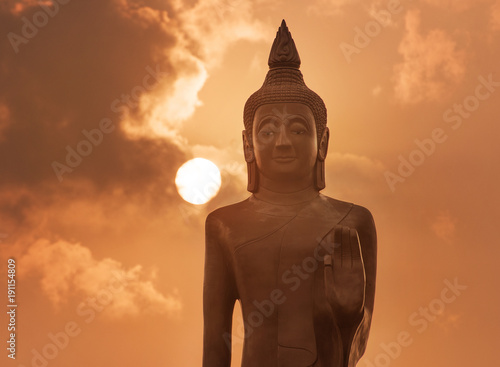 Buddha statue at sunset in Ubon Ratchathani, Thailand