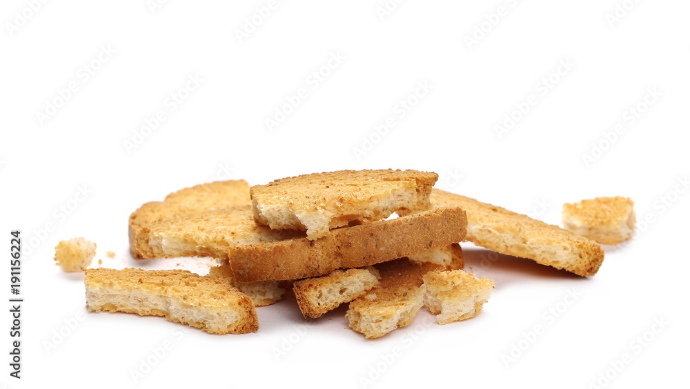 Integral crumbled rusks pile with wholewheat flour, bread slices isolated on white background Integral crumbled rusks pile with wholewheat flour, bread slices isolated on white background