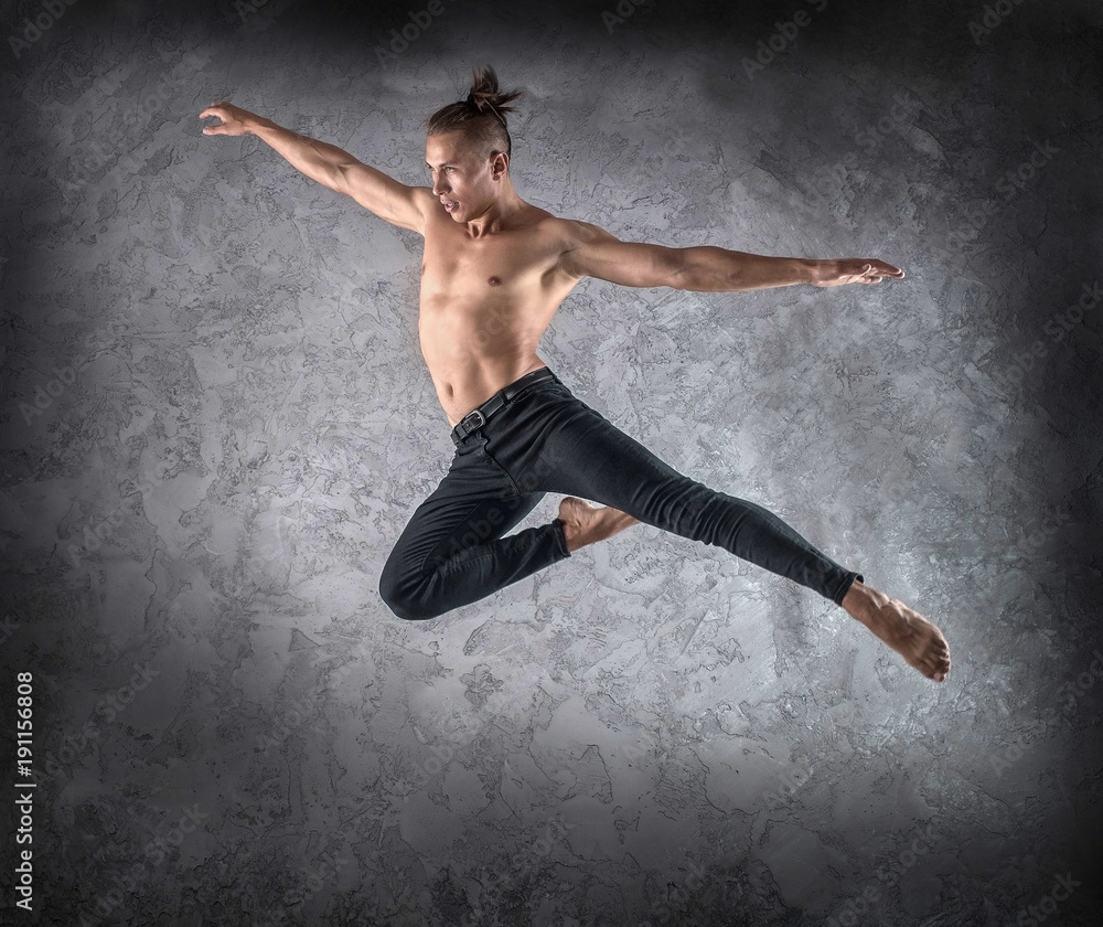 Fototapeta premium Man dancer, in beautiful dynamic jump action figure on the grung